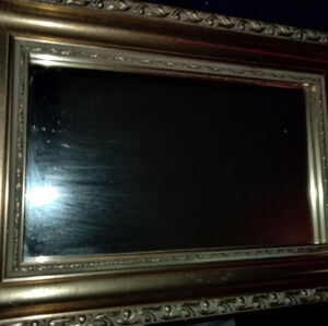 Gold framed wall mirror
